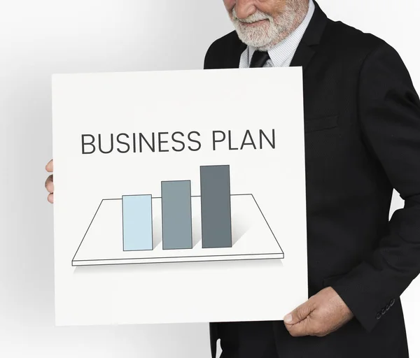 Businessman holding banner — Stock Photo, Image