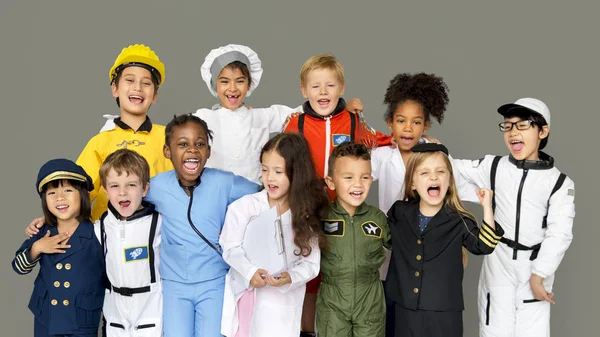 Crianças em trajes de várias profissões — Fotografia de Stock