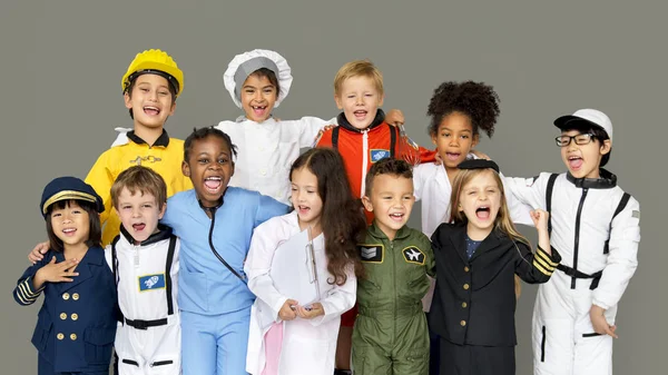 Kids in costumes of various professions — Stock Photo, Image