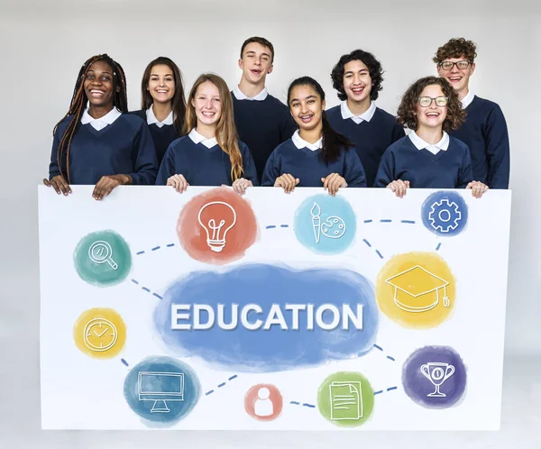 Students holding billboard — Stock Photo, Image