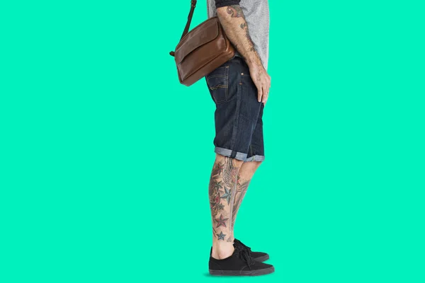 Male legs with tattoos — Stock Photo, Image