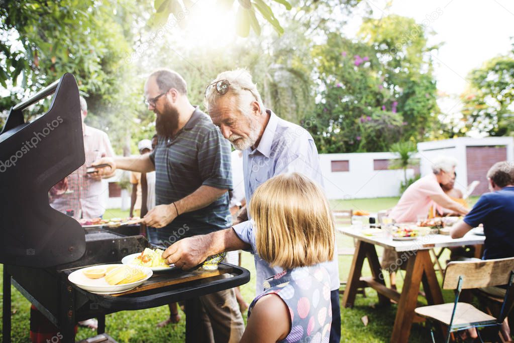 family having barbecue party