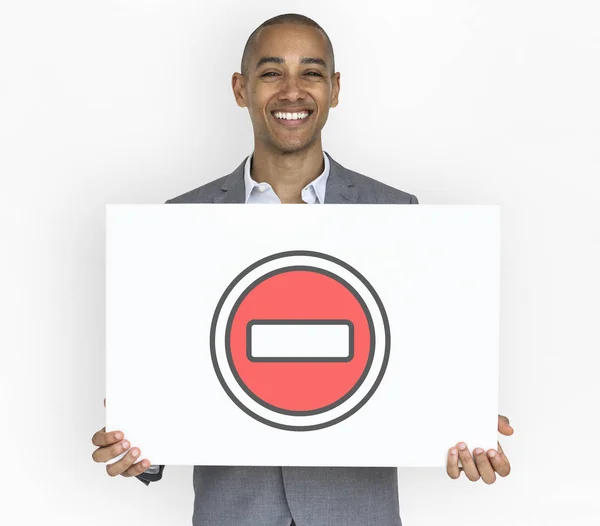 Businessman holding placard — Stock Photo, Image