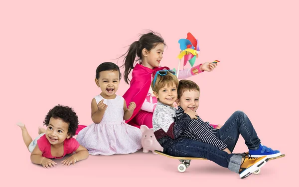 Kids with toys in studio — Stock Photo, Image