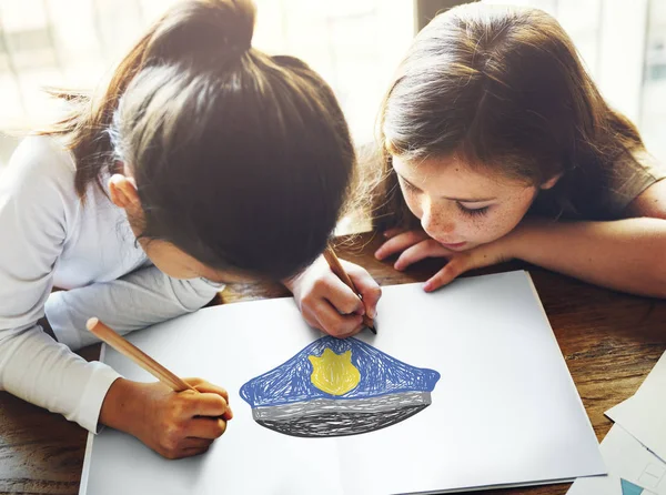 Two girls drawing on paper — Stock Photo, Image