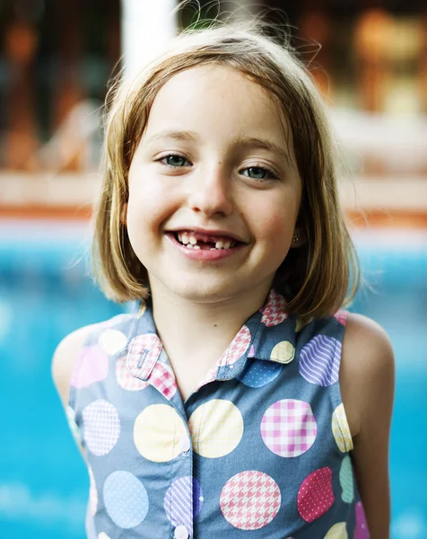 girl standing near pool