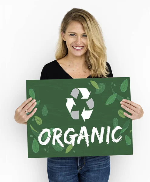 Blonde woman holding placard — Stock Photo, Image