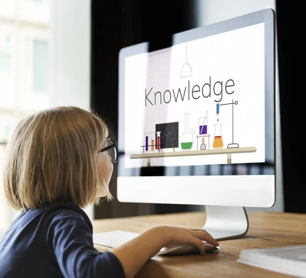 Little girl looking at monitor screen — Stock Photo, Image