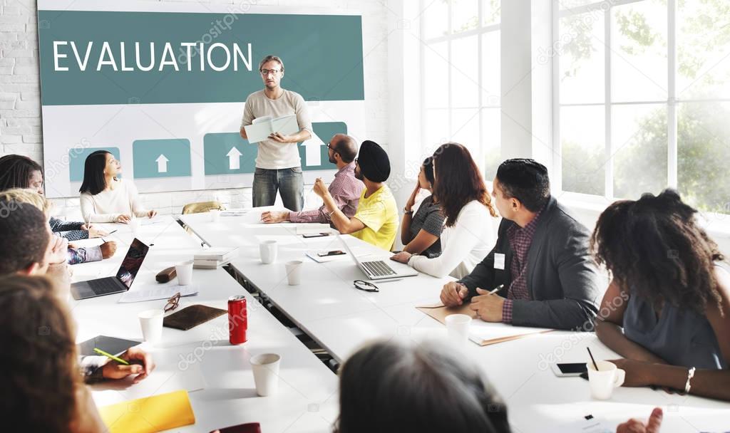 Business people at meeting in conference room with Evaluation concept