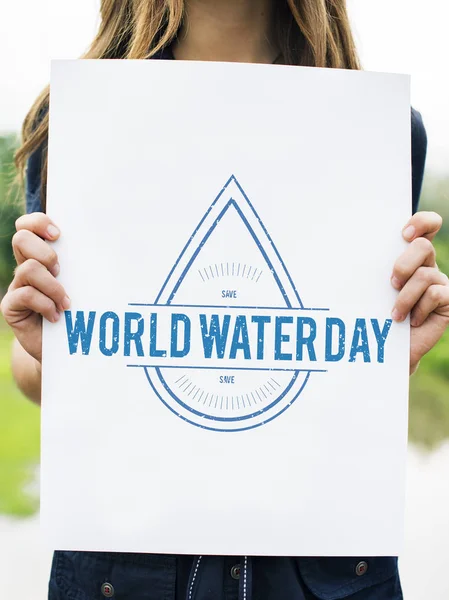 Woman holding banner with water drop — Stock Photo, Image