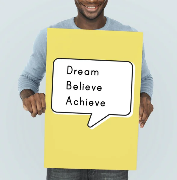 African man holding graphic banner — Stock Photo, Image