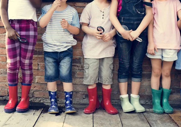 Children standing in a row — Stock Photo, Image