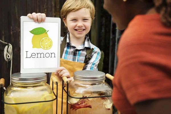 Boy showing digital tablet — Stock Photo, Image