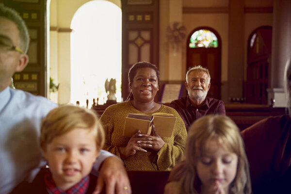 People praying in the Church