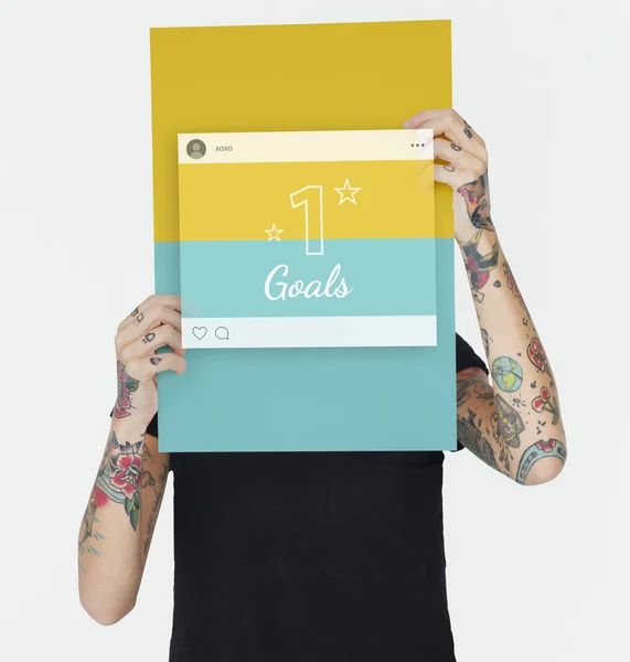 Tattooed woman holding placard — Stock Photo, Image