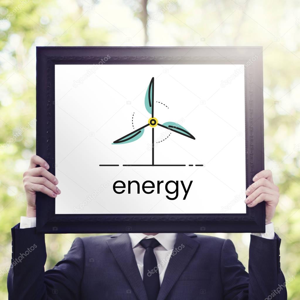 Young businessman holding placard in the park, Energy concept