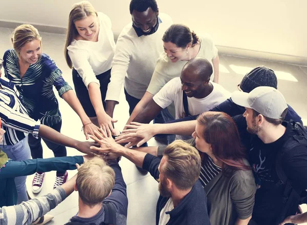 People holding hands together — Stock Photo, Image