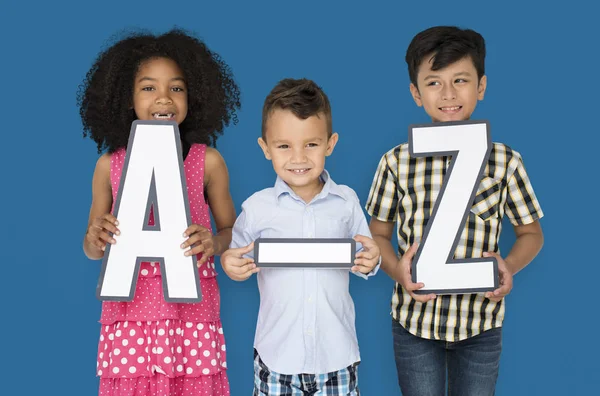 Children Holding A-Z Paper Letters — Stock Photo, Image