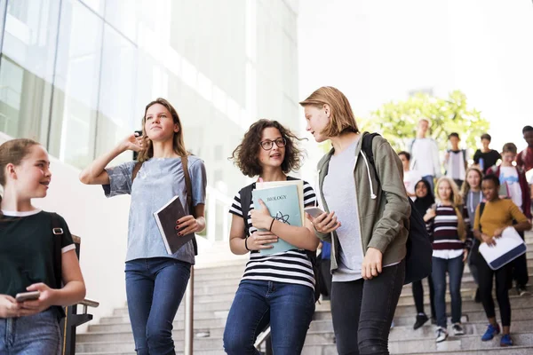 Group of students walking on stairs — Stock Photo, Image