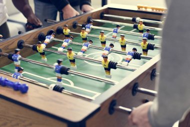 People Playing table football clipart