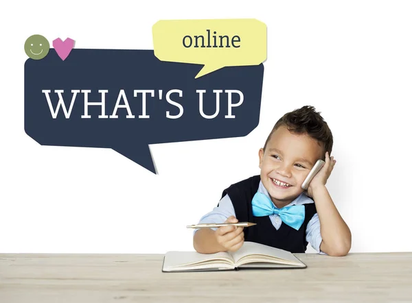 Schoolboy siting at desk — Stock Photo, Image