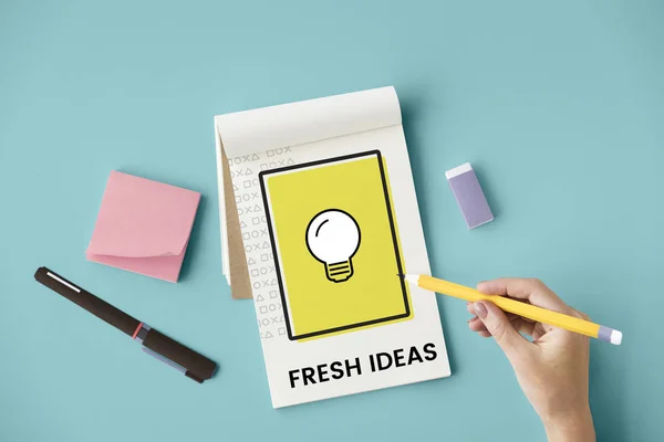 Woman writing in notebook — Stock Photo, Image