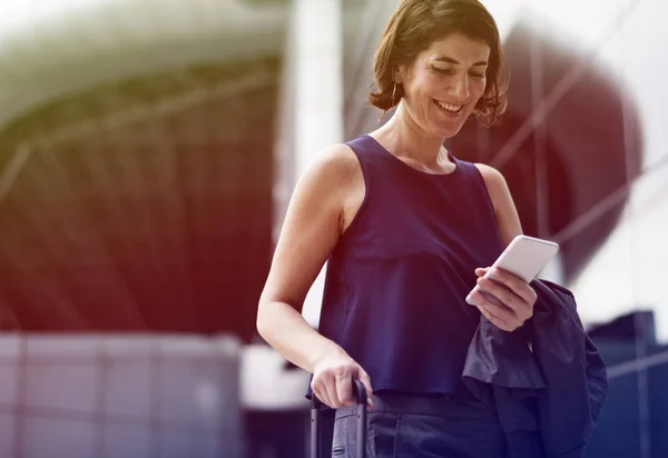 Business woman walking with luggage