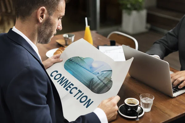 stock image businessman holding booklet 