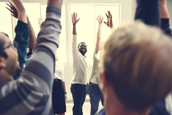 People keeping hands raised