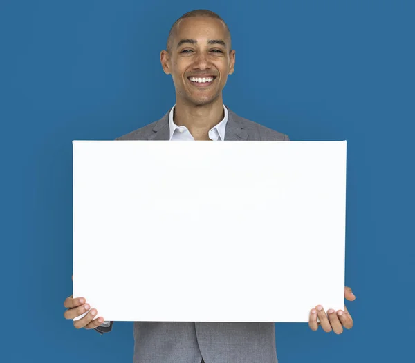 Business man presenting placard — Stock Photo, Image