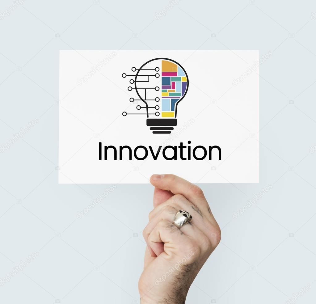 Humans hand holding card with Graphic: Innovation