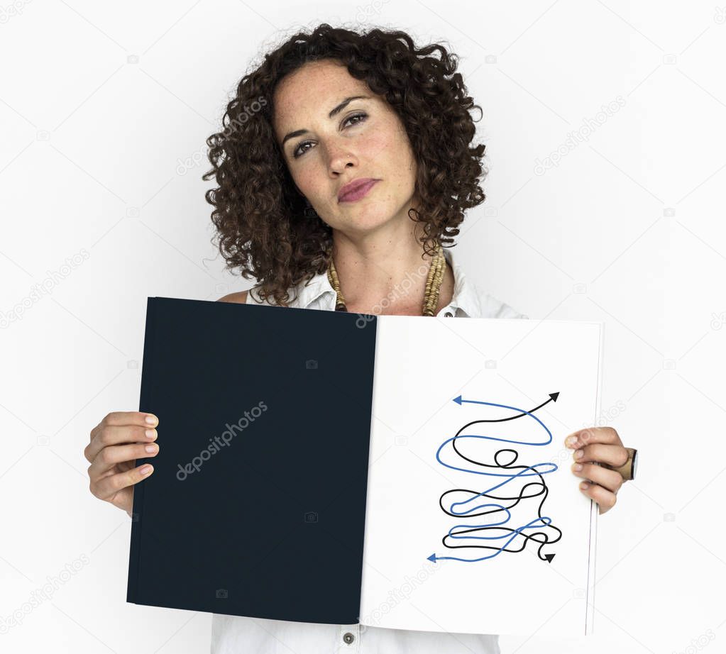 woman holding open notebook
