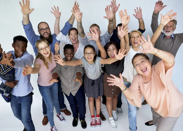 Pessoas com as mãos levantadas — Fotografia de Stock