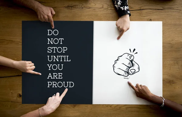 Hands on table with graphic placard — Stock Photo, Image