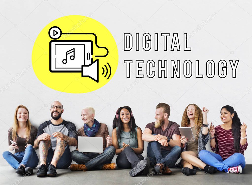 Diverse group of people sitting on the floor talking and using digital devices, Digital Technology Concept