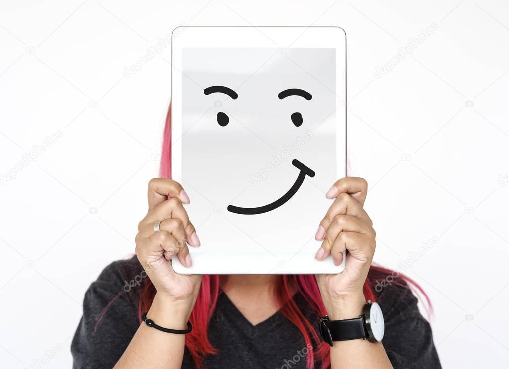 digital tablet covering face