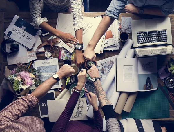 Colleagues making stack of hands — Stock Photo, Image