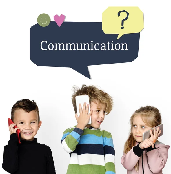 Kids talking at mobile phones — Stock Photo, Image