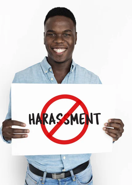 Man smiling and holding announcement banner — Stock Photo, Image