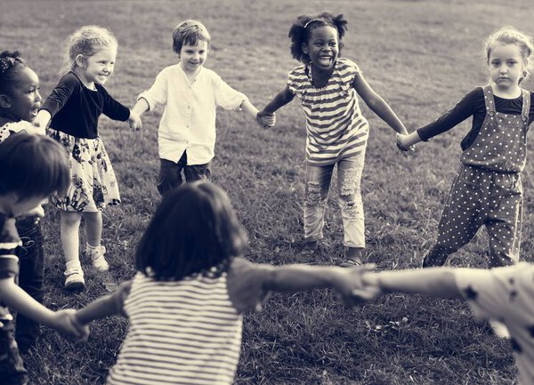 kids holding hands and playing 