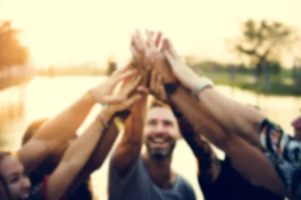 Friends at party holding hands together — Stock Photo, Image