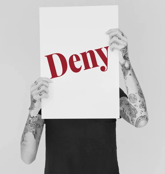 Tattooed woman holding placard — Stock Photo, Image