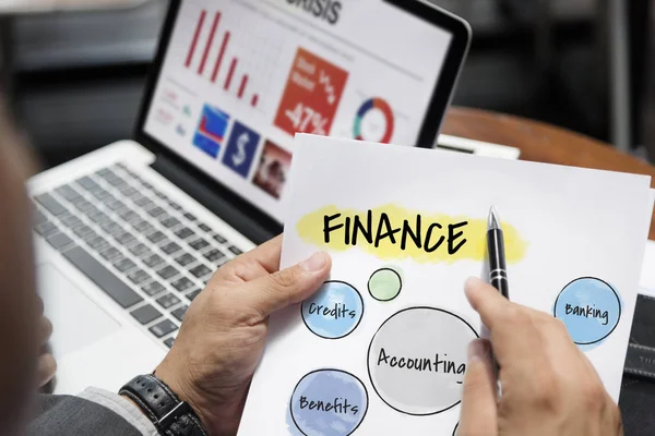 Man in suit pointing on paper sheet — Stock Photo, Image