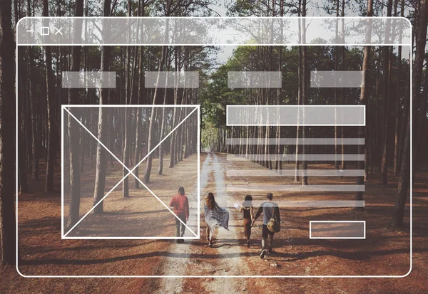 Four young people walking in forest — Stock Photo, Image