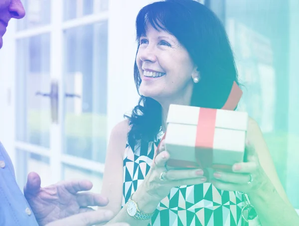 Woman holding a box of present — Stock Photo, Image