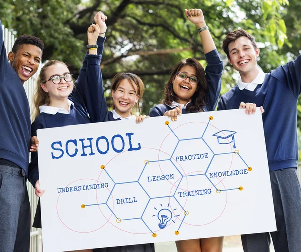 Happy multicutural students with banner — Stock Photo, Image