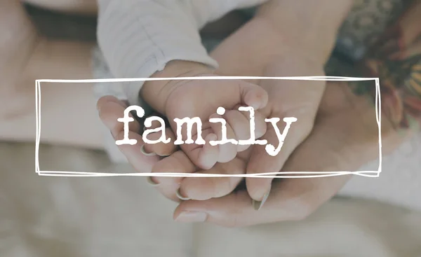 Parents holding hand of newborn baby — Stock Photo, Image