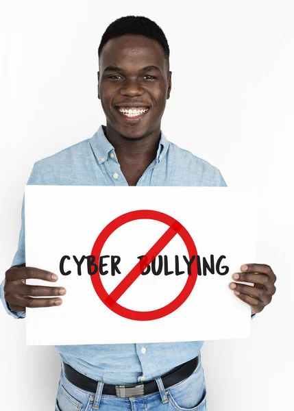 Man smiling and holding announcement banner — Stock Photo, Image