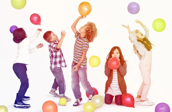 Children playing with balloons — Stock Photo, Image