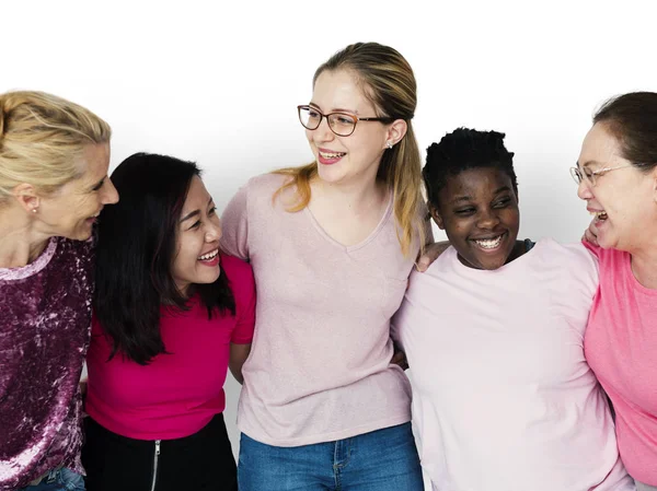 Women embracing in studio — Stock Photo, Image